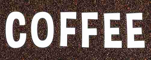 Free photo transparent word coffee on a background of coffee beans mockup for advertising