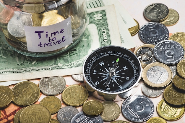 Free photo travel background with money and compass