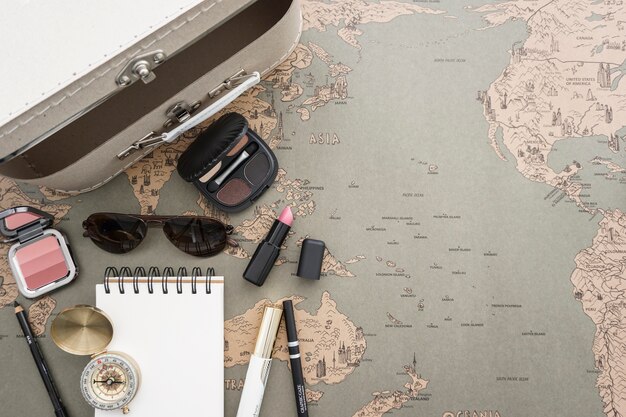 Travel background with suitcase and beauty accessories