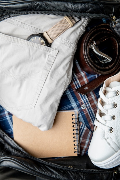 travel bag with sneakers and trousers