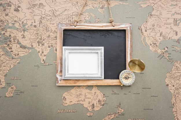 Travel composition with slate, frame and compass