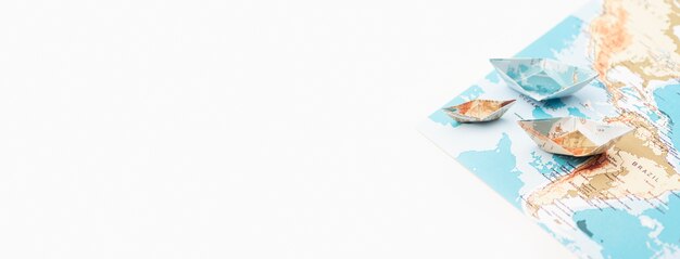 Travel concept with paper boats frame