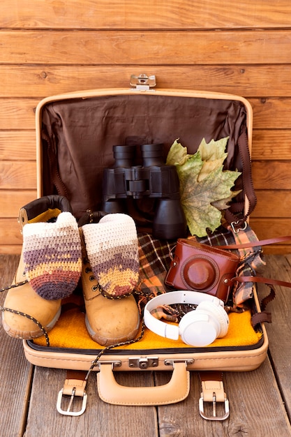 Free photo travel elements arrangement on luggage