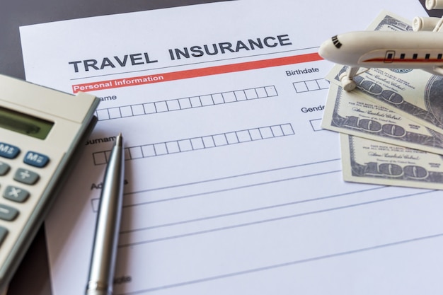 Premium Photo | Travel insurance form with model and policy document