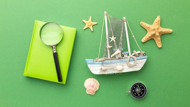 Travel items on green background top view