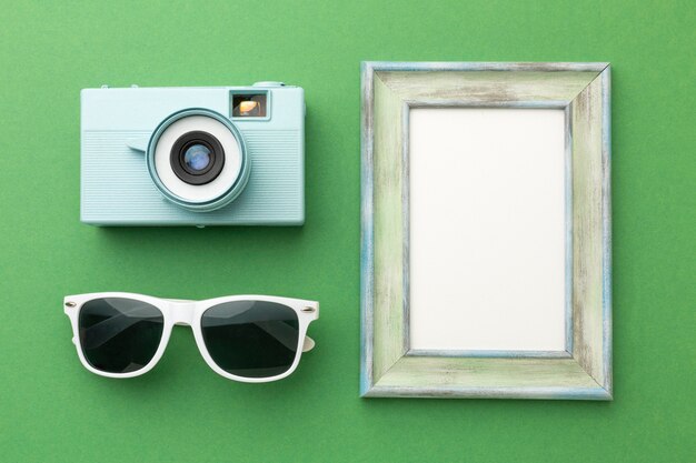 Travel items on green background above view