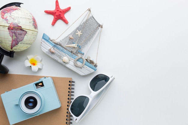 Travel items on white background above view