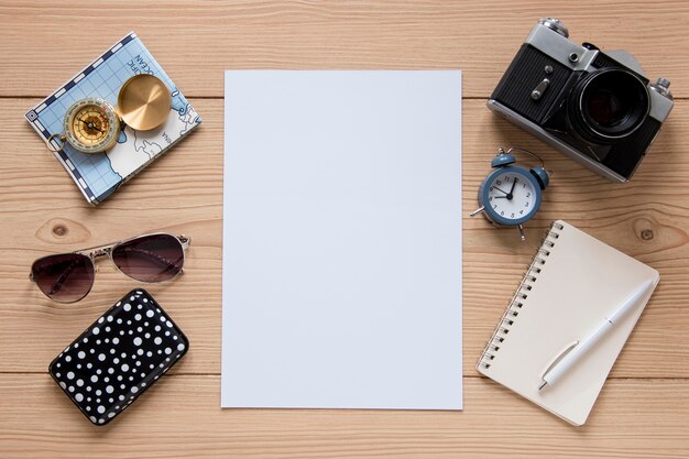 Travel items on wooden background