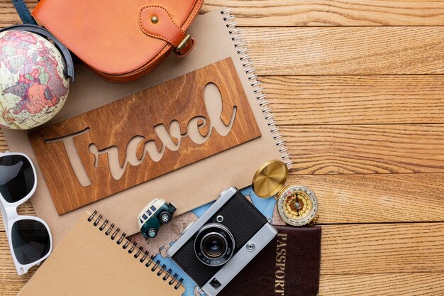 Travel items on wooden background