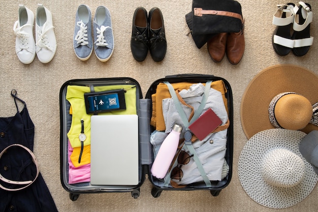 Free photo travel suitcase and preparations packing