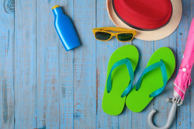 Travel,Summer accessories on blue wood