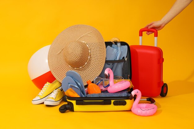 Travel and vacation holidays composition with suitcase