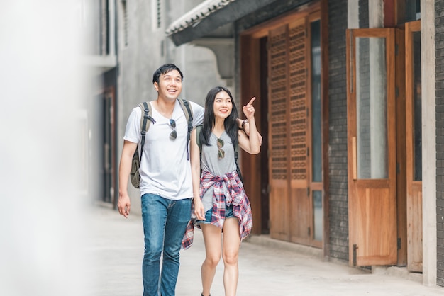 Traveler Asian backpacker couple feeling happy traveling in Beijing, China