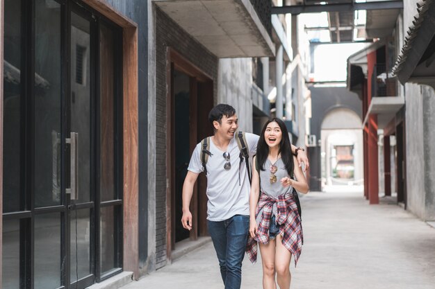 Traveler Asian backpacker couple feeling happy traveling in Beijing, China