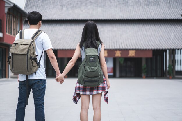 Traveler Asian backpacker couple feeling happy traveling in Beijing, China