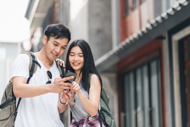 Traveler Asian couple direction on location map in Beijing, China