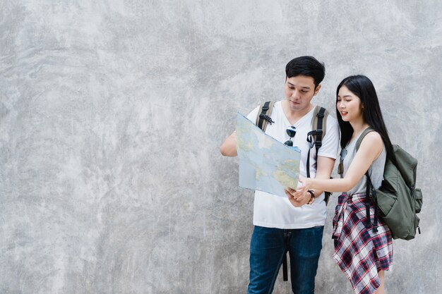 Traveler Asian couple direction on location map in Beijing, China