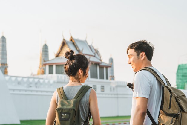 Traveler Asian couple traveling and walking in Bangkok, Thailand