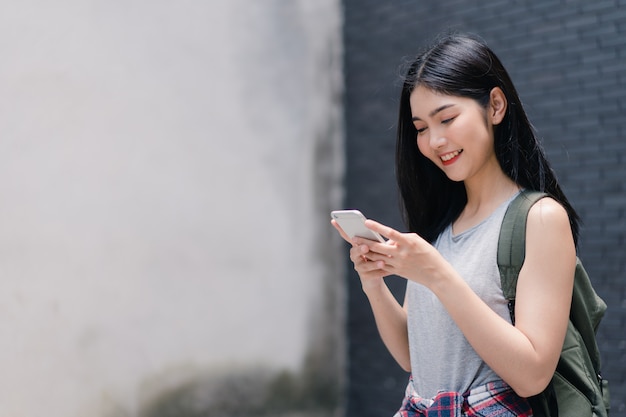 Traveler Asian woman direction on location map in Beijing, China