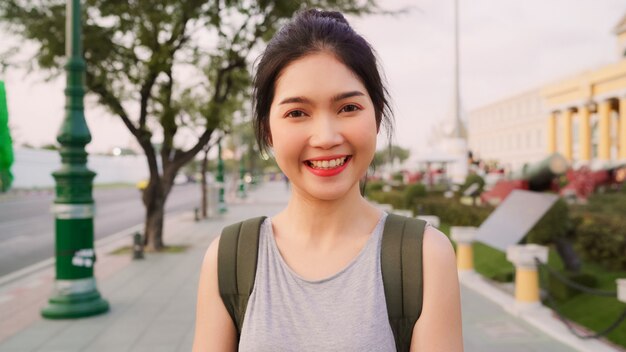 Traveler Asian woman feeling happy smiling to camera holiday trip at Bangkok, Thailand