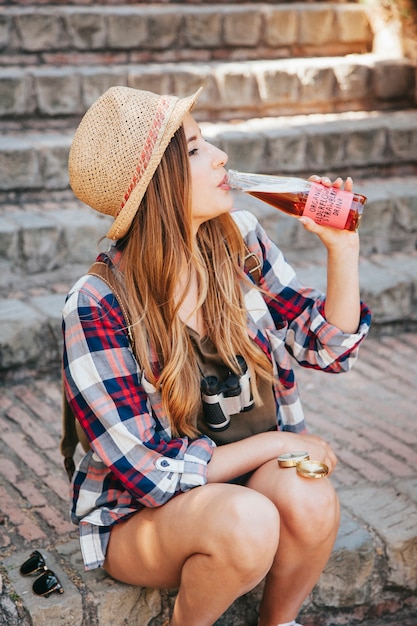 Free photo traveler drinking a refreshing drink