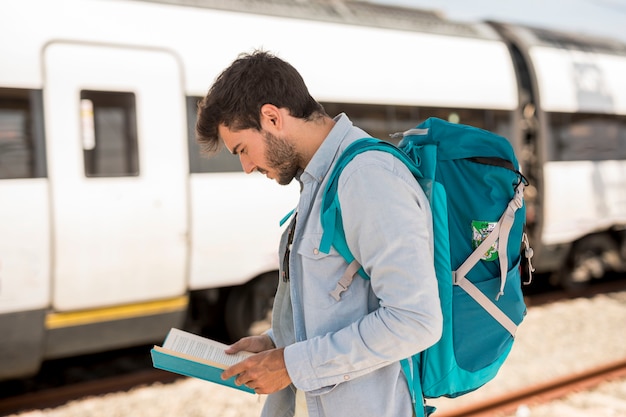 Traveler looking at the book