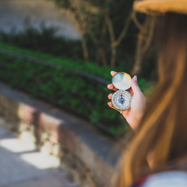 Traveler looking at her compass