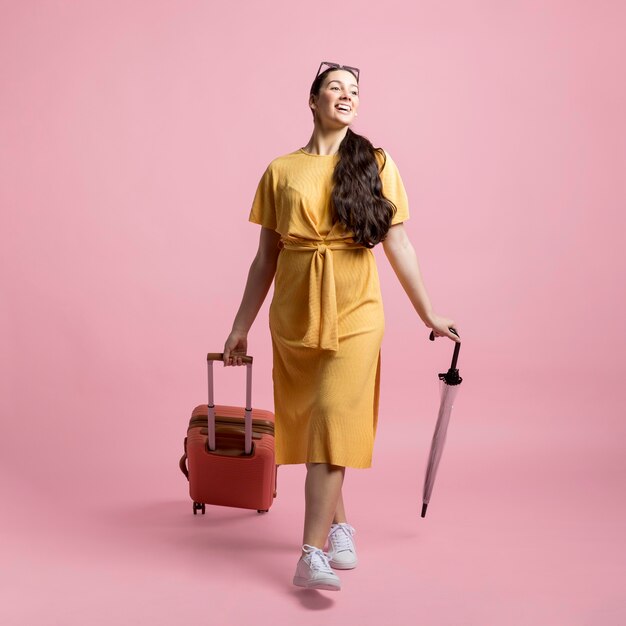 Traveler posing with pink background