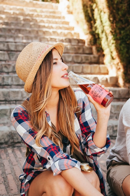 Free photo traveler sitting and drinking