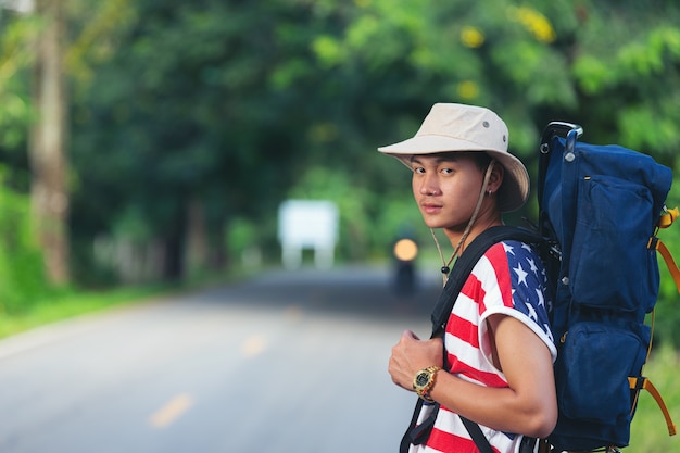 Free photo traveler standing on country road