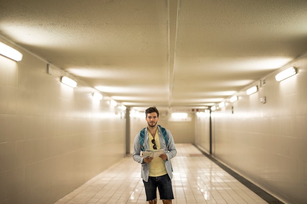 Traveler in underpass at train station