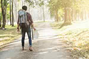 Free photo traveler with backpack relaxing outdoor.