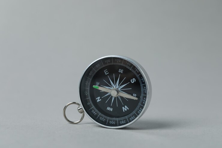 Free Photo traveling adventure and vacation concept with compass