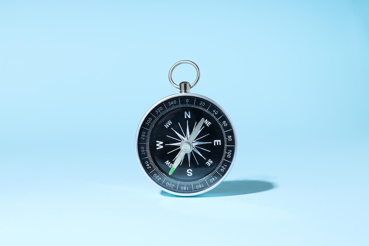 Free Photo traveling adventure and vacation concept with compass
