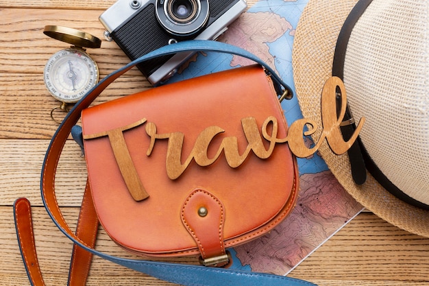 Free photo traveling items on wooden background top view