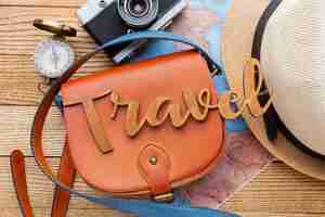 Free photo traveling items on wooden background top view