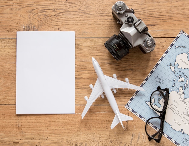 Traveling items on wooden background