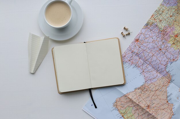 Traveling map, diary and coffee cup