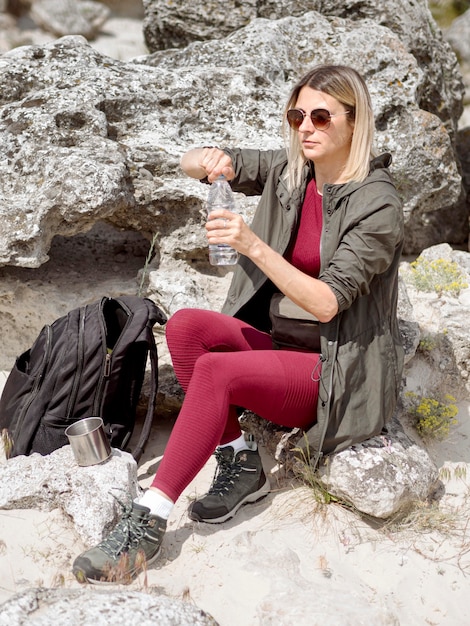 Traveling woman drinking water