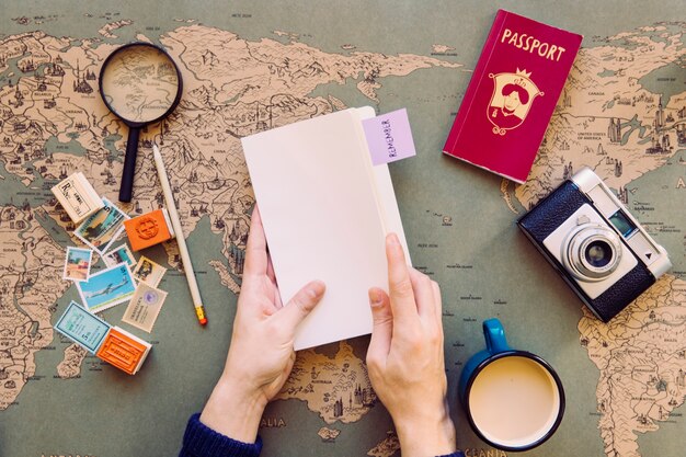 Traveller holding blank notepad