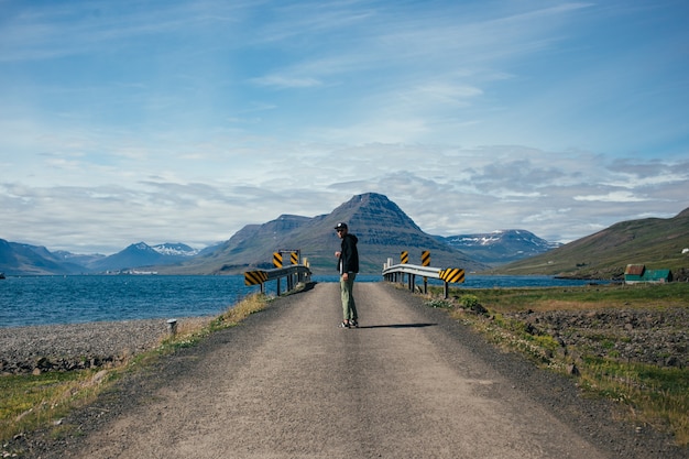 Traveller man with backpack explores iceland