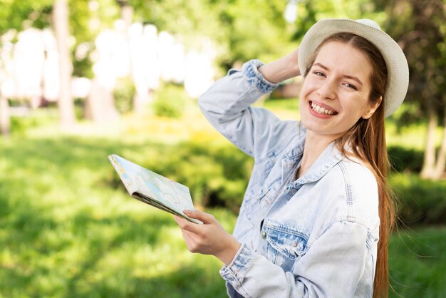 Traveller in the park holding a map