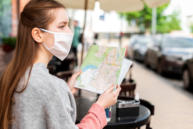 Traveller sitting and using a map