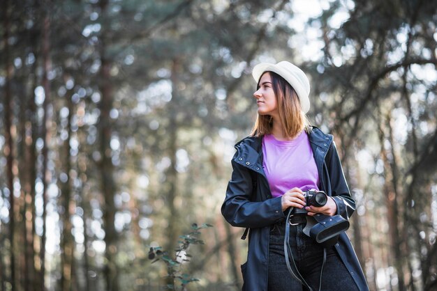 Traveller with camera looking away