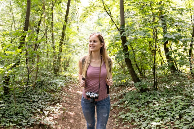 Free photo traveller in woods looking away