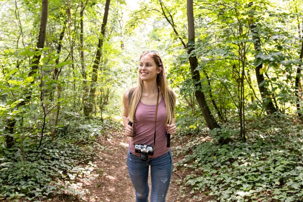 Traveller in woods looking away