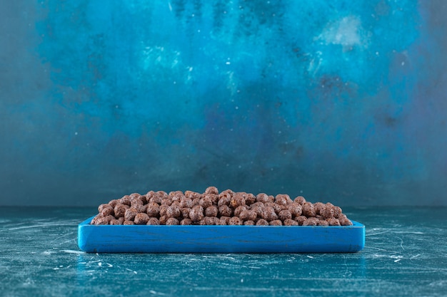tray-corn-balls-blue-background-high-quality-photo_114579-75390.jpg
