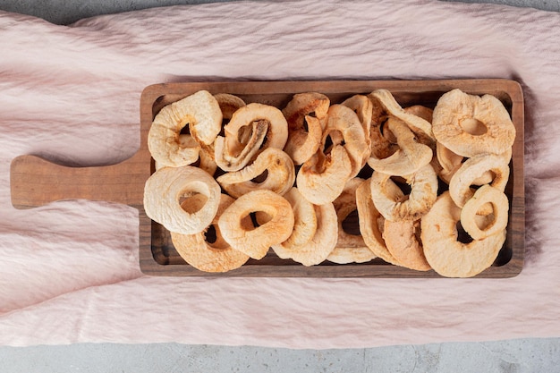 Free photo tray of fried apple rind on textile fabric.