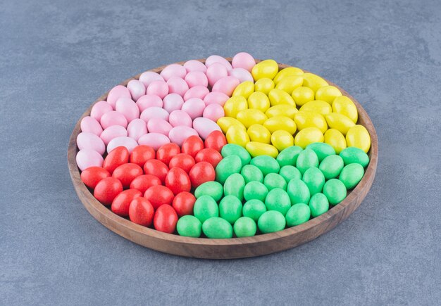 A tray full of gum on the marble background. 