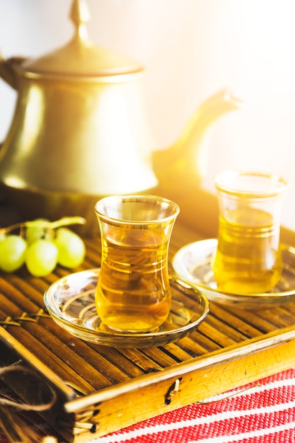 Free photo tray of moorish tea with grapes